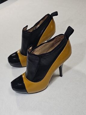 L.A.M.B. Black and Mustard Two-Tone Stiletto Booties